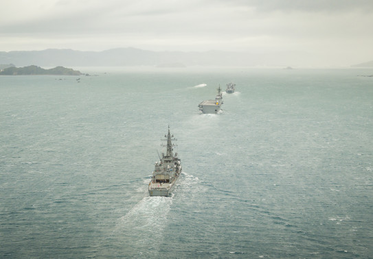 Three ships, photographed from a helicopter sail into Wellington harbour.