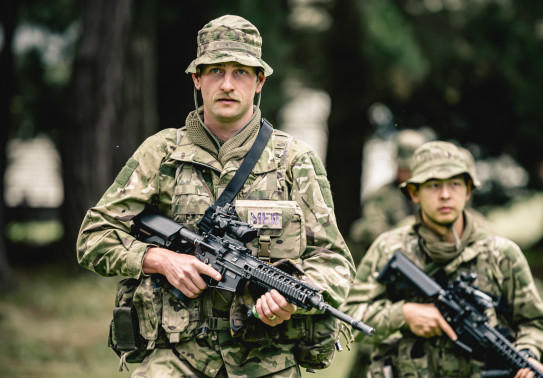 Private Gallant and a fellow recruit listen to a brief prior to leaving for the field phase of training